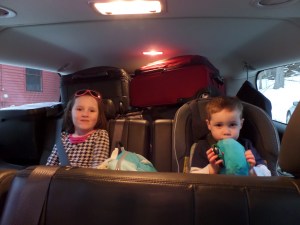 Riding in style to the airport. Visibility out the back window nil. 