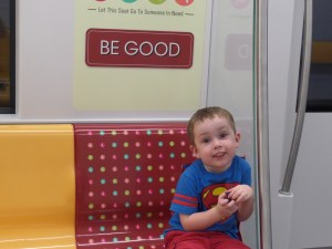 Riding the MRT ... seats reserved for those in need of a seat (including mothers holding almost 4 year olds) are marked with sayings about being good and kind ... he has memorized all of them - now has five more site words:)